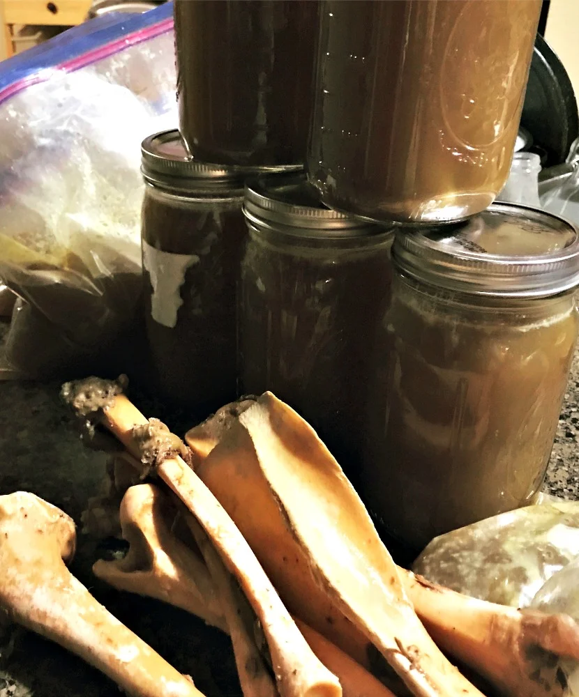 This is not the best picture, but you can see how clean and much more fragile the bones are after simmering for three days. I used a combination of Mason jars and gallon freezer bags for this batch of broth. I ended up with eight quarts! Nice!