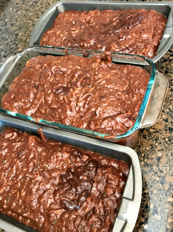 Into the loaf pans! I had these filled too full, and next time, I'll either use another regular loaf pan and make smaller loaves, or just use a mini loaf pan to take care of the extra batter and just get it out of the oven earlier. 