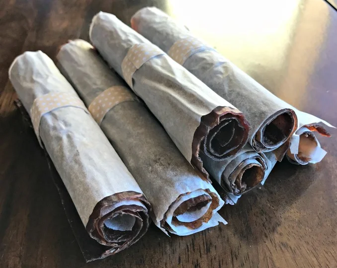 Here they are all rolled up! I had to use my rather crinkly parchment paper I used to dehydrate them with because I was all out---otherwise, these fruit rolls would have been better looking---