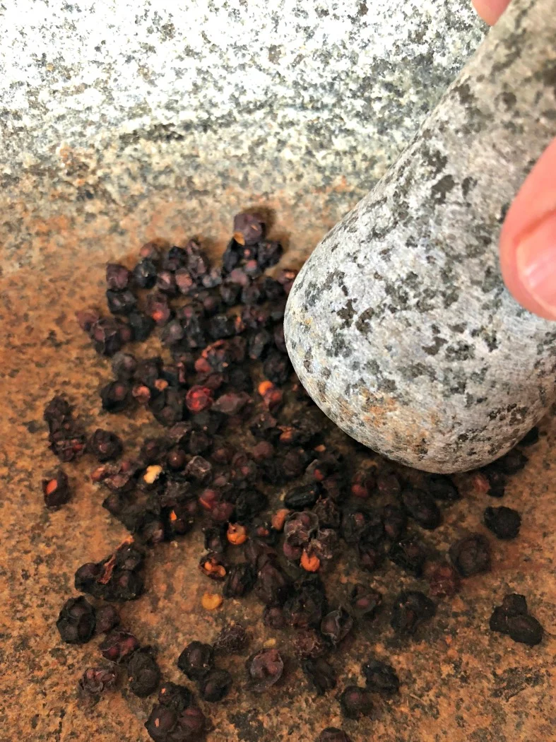 These are the dried Schisandra berries. They are quite hard and tough, so I like to crush them using my mortar and pestle. This helps them release their helpful plant constituents during a long infusion or decoction.