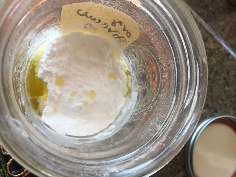 Step 2) Once the butters are melted, remove the jar from the double boiler, and add your powders and essential oils and Vitamin E---- STIR well!