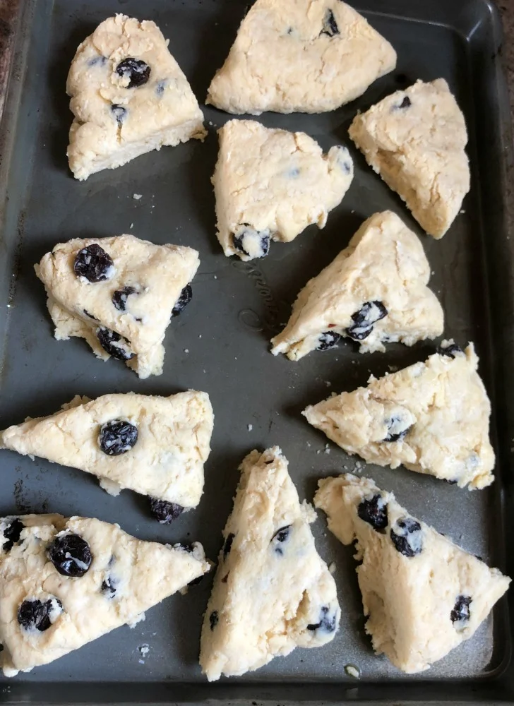 Uncooked scones on the pan.