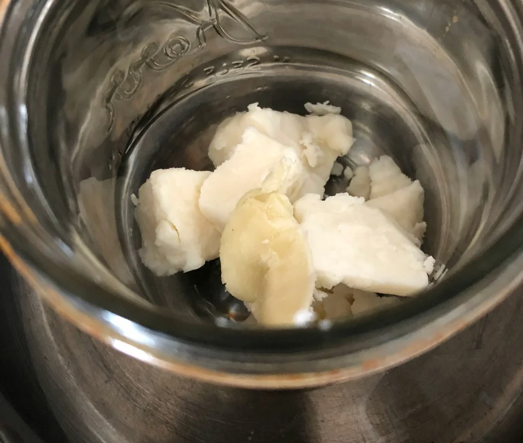 Here are the butters (Mango & Shea) melting in my makeshift double boiler. All you need is a pint Mason jar, a pan, and a bit of water. Easy!