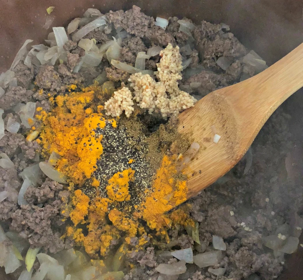 Adding the spices---