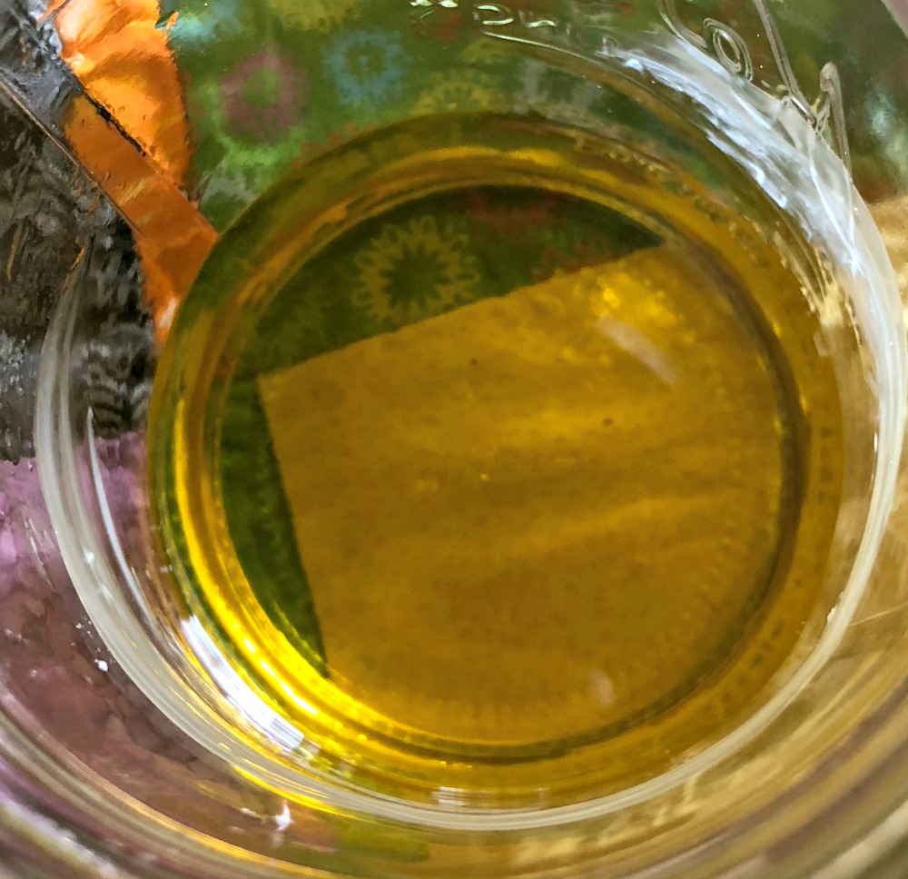 Liquid oils and beeswax. Now is when you stir your essential oils in!