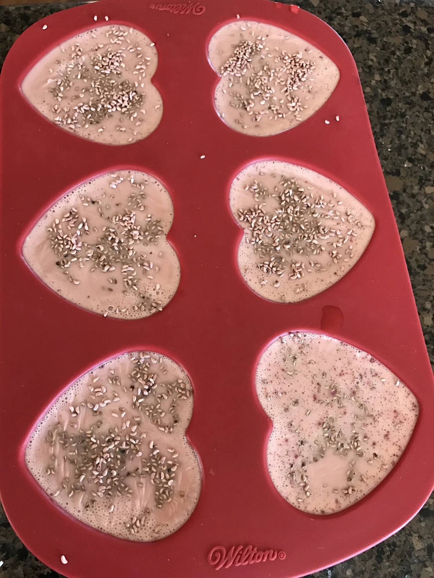 Here is some goats milk soap with French pink clay and raspberry seeds added.