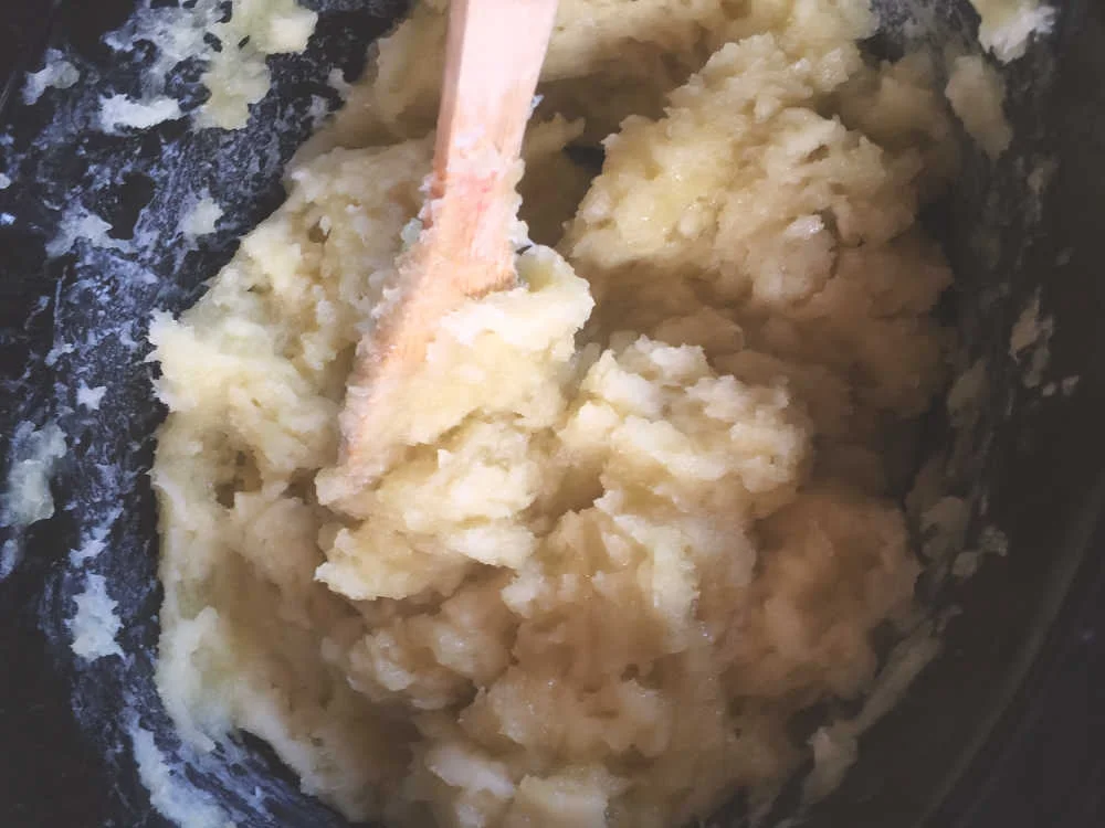 This is the first stir. You can still see opaque areas in the mixture--this means it is still caustic and can burn! Plus, it's hot anyway. This stage is often called the “mashed potato” stage.