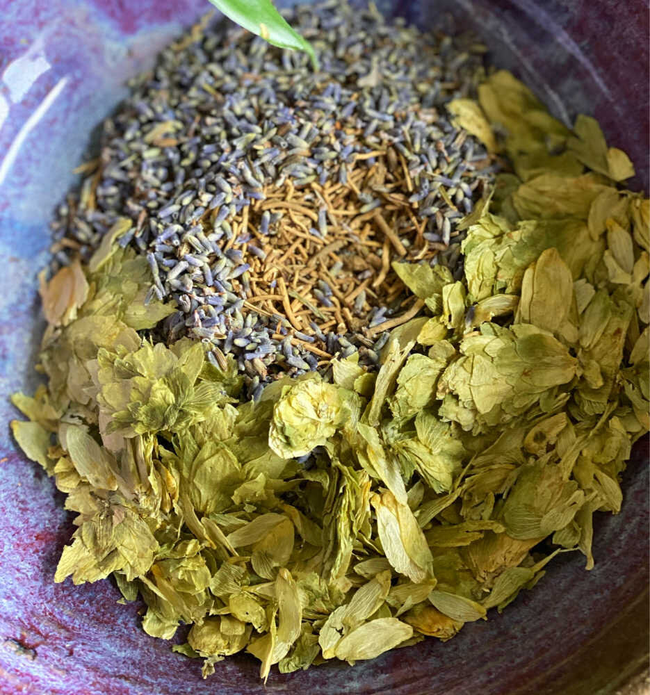 The herbs being blended in a bowl.