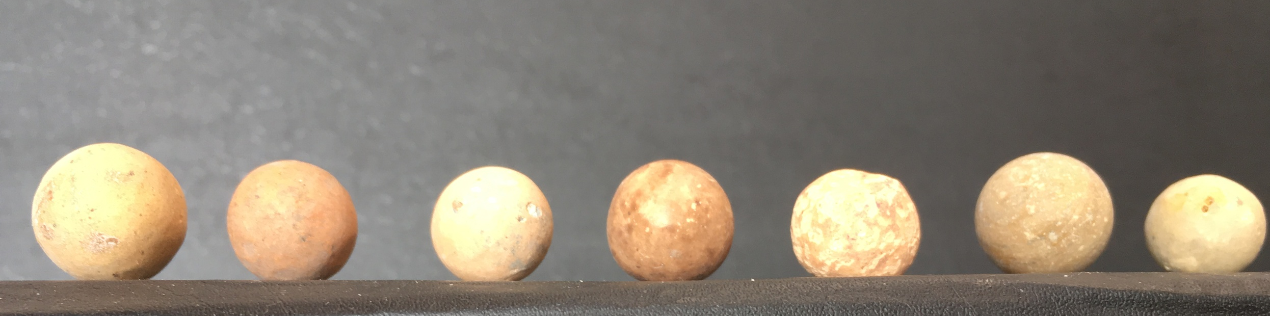 Clay marbles of many shapes and colors