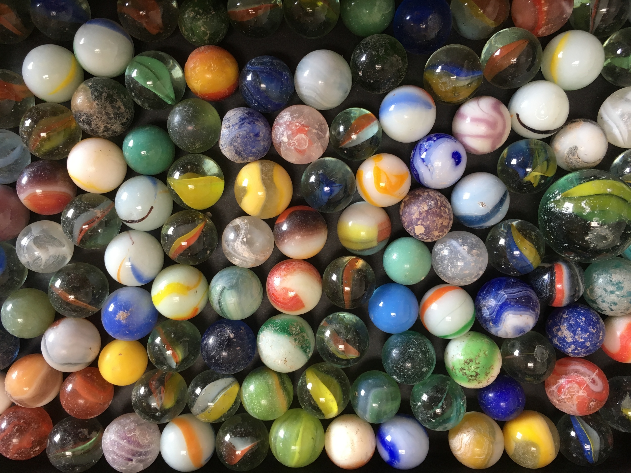 A few of the hundreds of marbles I've found downtown.