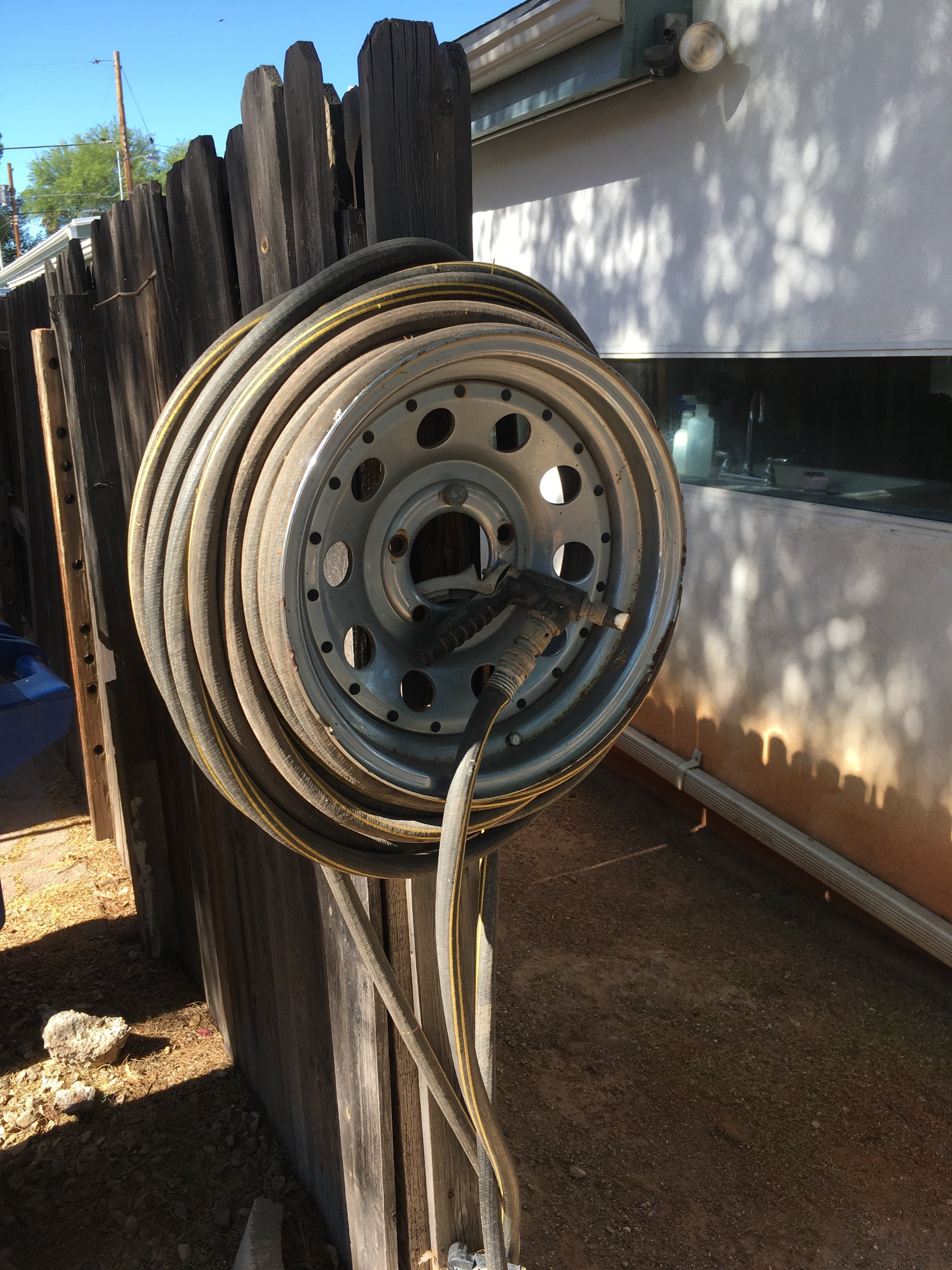 A hose wrangler in the Rincon Heights neighborhood.