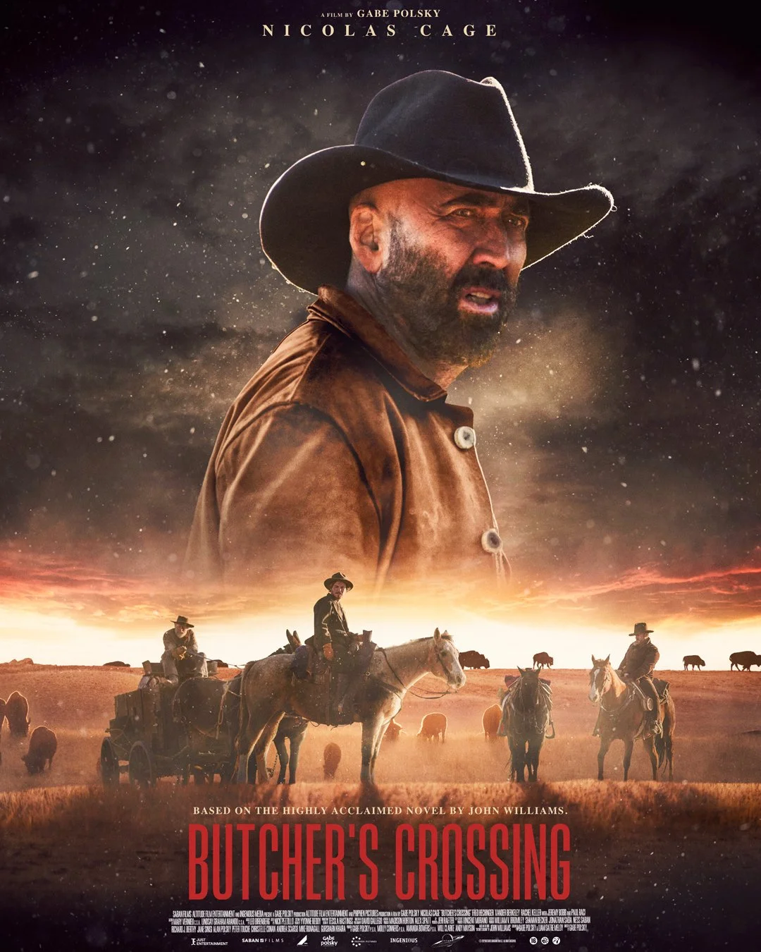 Movie poster for 'Butcher's Crossing' featuring a close-up of Nicolas Cage wearing a cowboy hat, with a group of cowboys on horseback and a vast open range in the background at sunset.