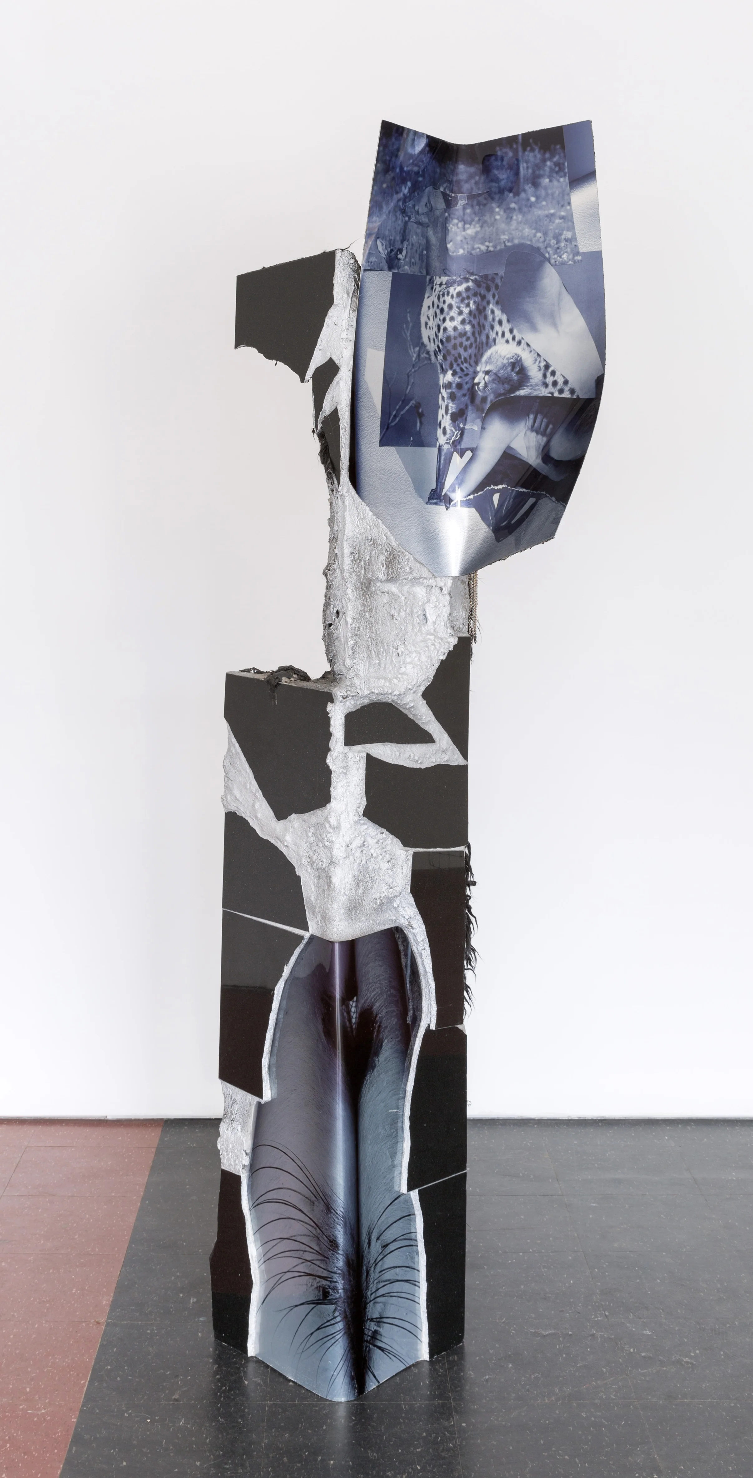 TOTEM V , 2016 concrete, tile, digital prints on aluminum, fur, metallic stain, necklaces, wood 84 x 48 x 3 in
