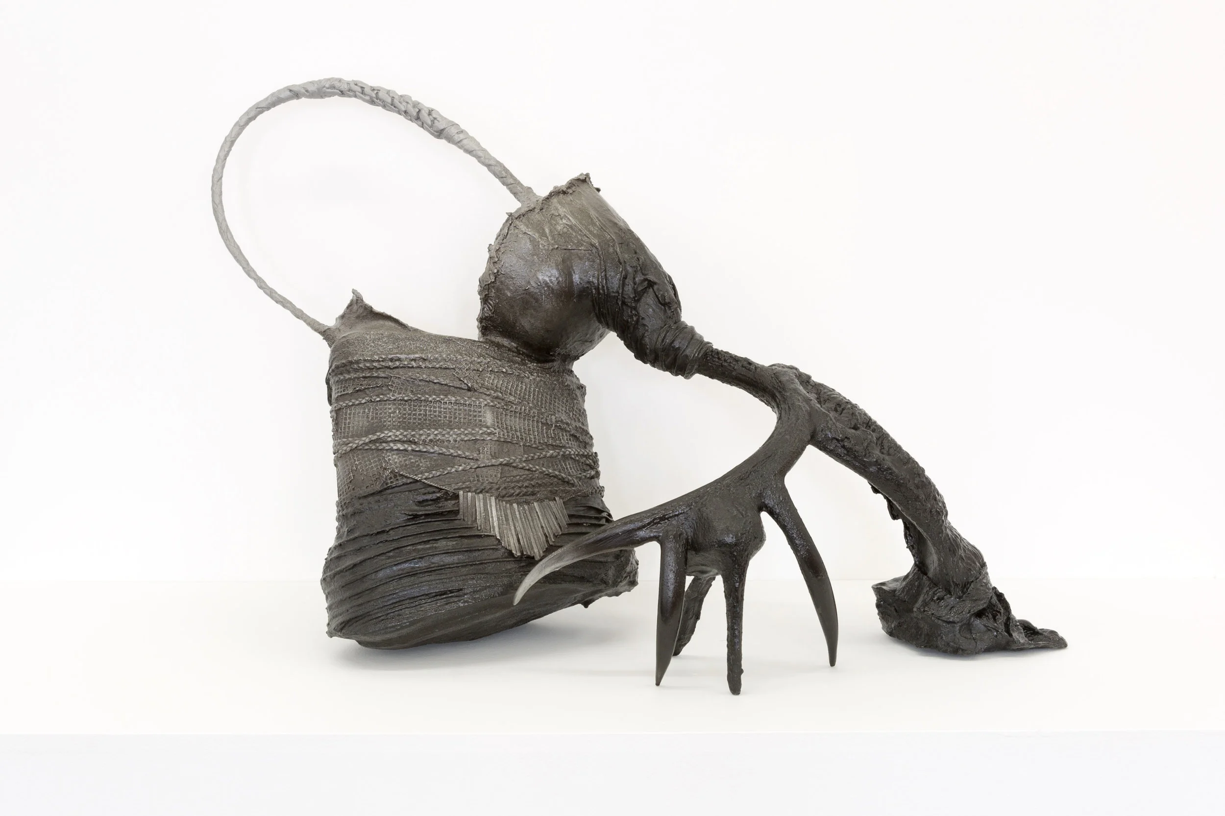 MODEL 4 , 2016-2017 cast aluminum with patina original objects: buck antler and stomach (decorative model), camel mask (theatrical model), whip (didactic model), stiletto (decoy model), goose neck (decoy model), nylons, bra underwire, Calvin Klein dress, facial mask, necklace, and wax 21 x 25 x 12 in