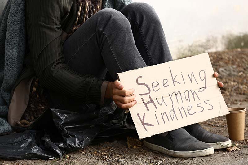 A beggar seeking human kindness