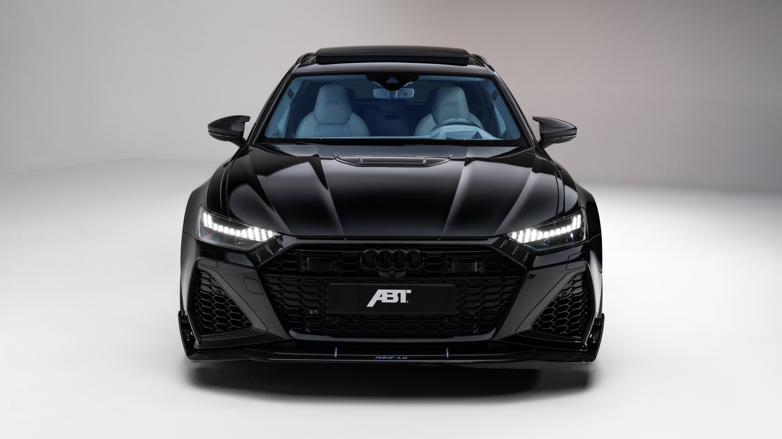 Front view of a black Audi electric vehicle with LED headlights and sporty design.