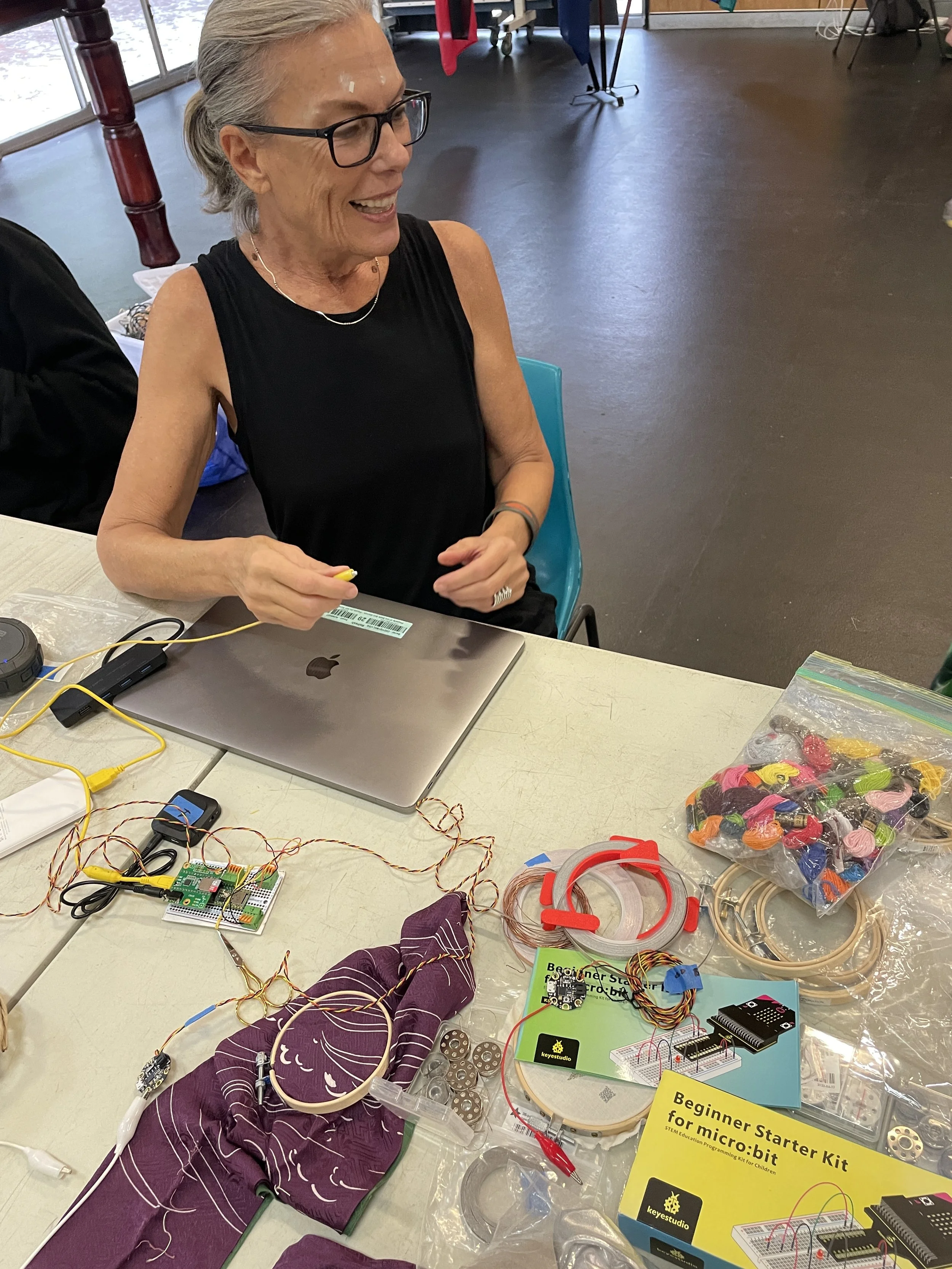 KD with stuff on talbe.JPG