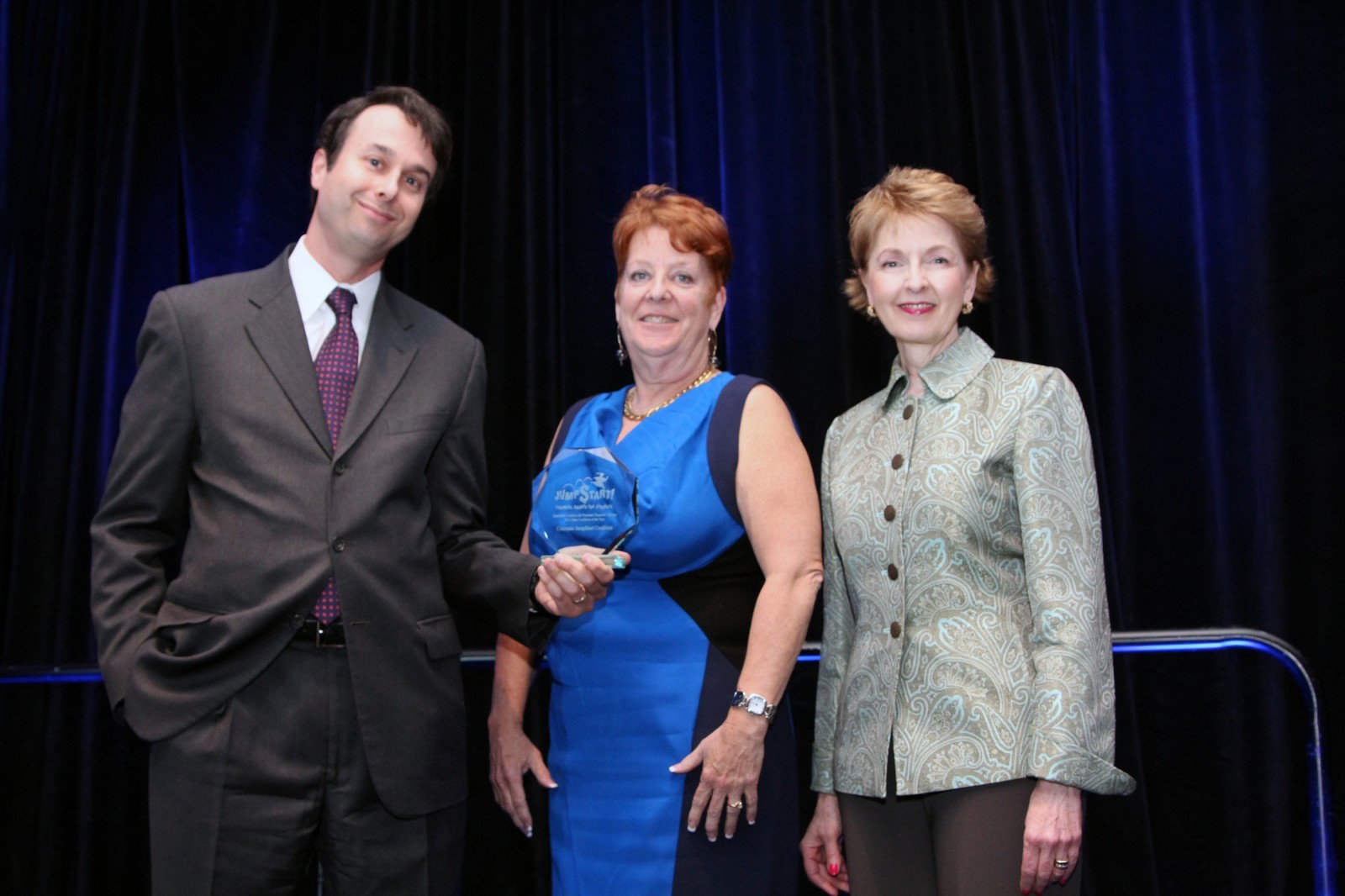 The Colorado Jump$tart Coalition accepts the 2013 State Coalition of the Year Award. Those pictured above include (from left to right): Jason Alderman, Visa Inc; Colorado Jump$tart Coalition Executive Director, C.J. Juleff; and Mary Medley, President & CEO, Colorado Society of CPAs and chairman of the Colorado Coalition board of directors.