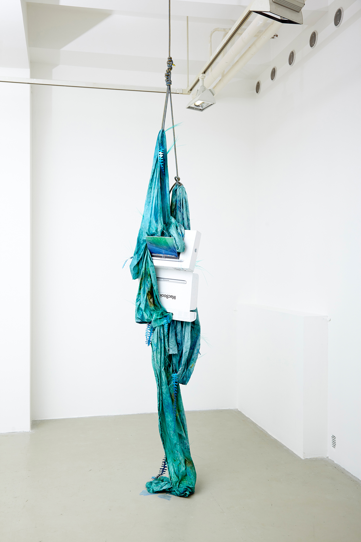 Let's Sink into the Deep Slowly, 2015, angin, water glass, self adhesive paper, foil, textil paint, Macbook Pro 13'' box, exhibition view at Trafó Gallery. | Photo: Krisztián Zana.