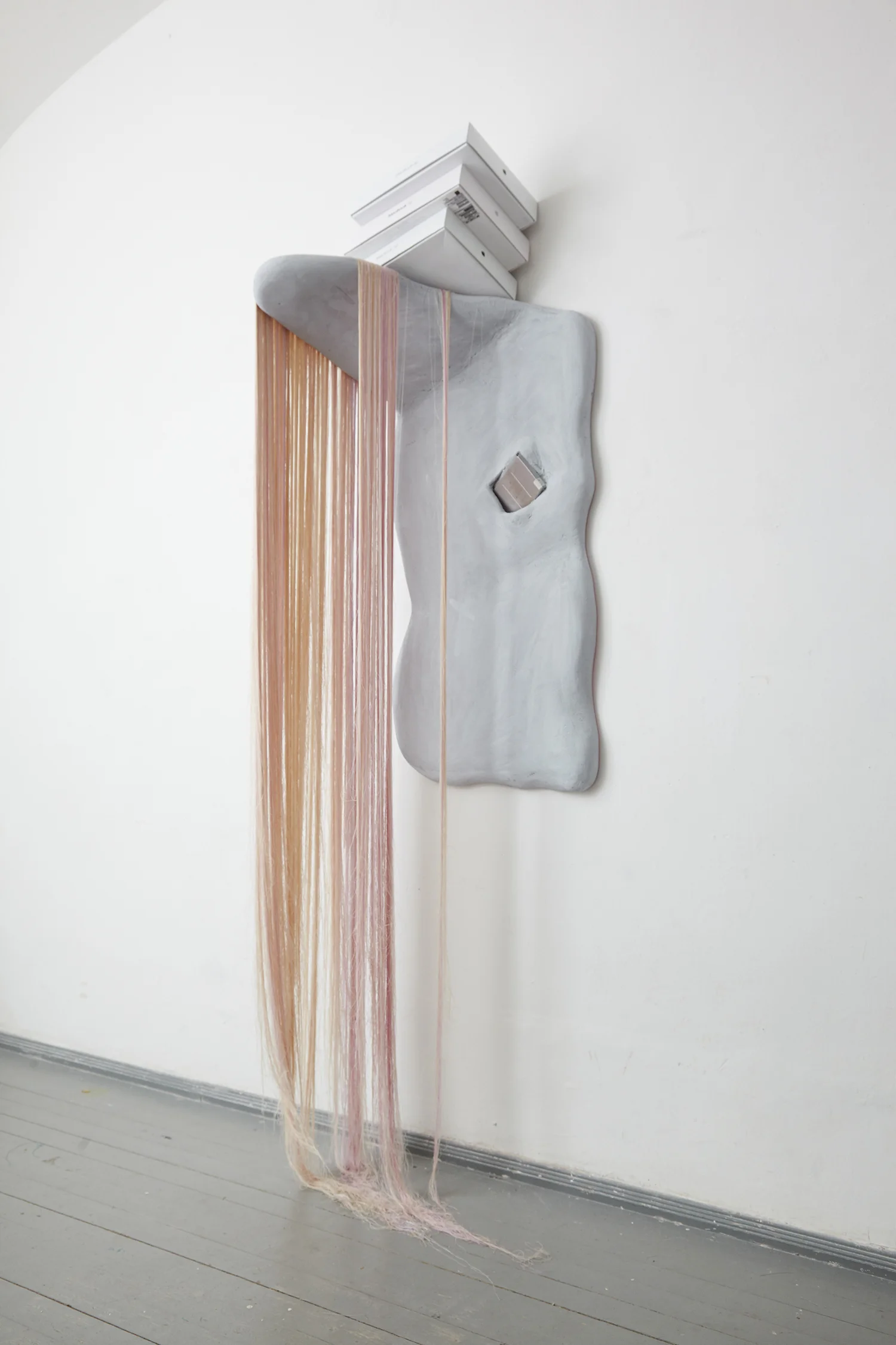 Tenaciousness of the Martyr, 2016, styrofoam, Macbook boxes, Macbook battery, thread, acrylic paint. | Photo: Krisztián Zana.