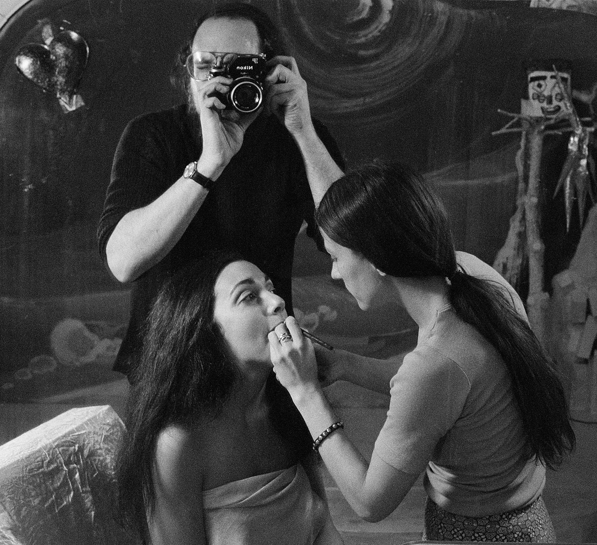 Photographer Peter Angelo Simon observing a model's makeup for a photoshoot in the Chelsea