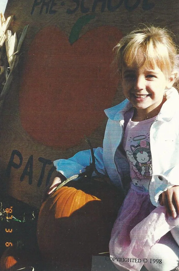 JonBenét finding the right pumpkin for Halloween.