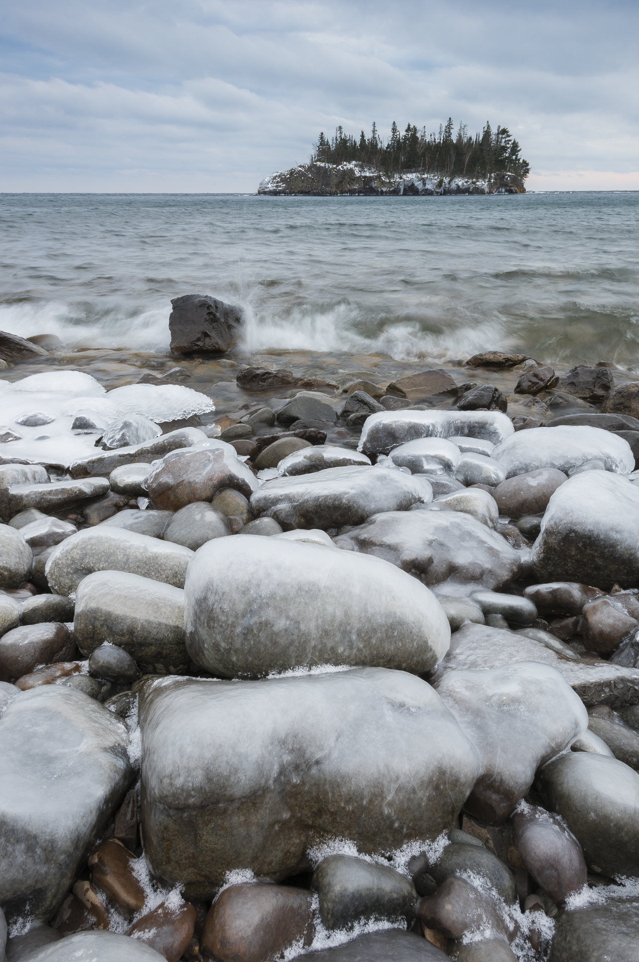 Ice-coated beach rocks and Ellingson Island.