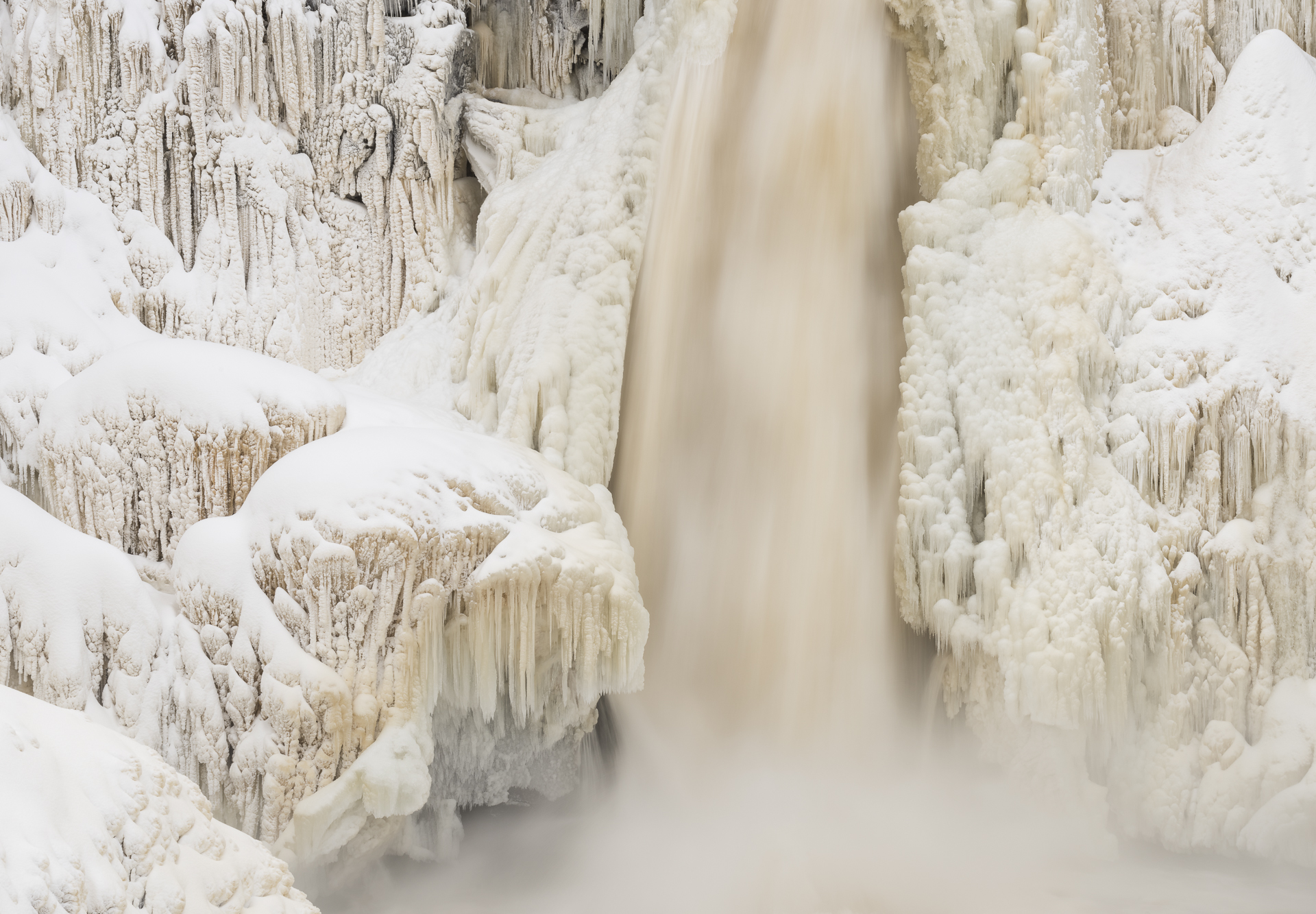 Pigeon River flowing through ice sculptures. December.