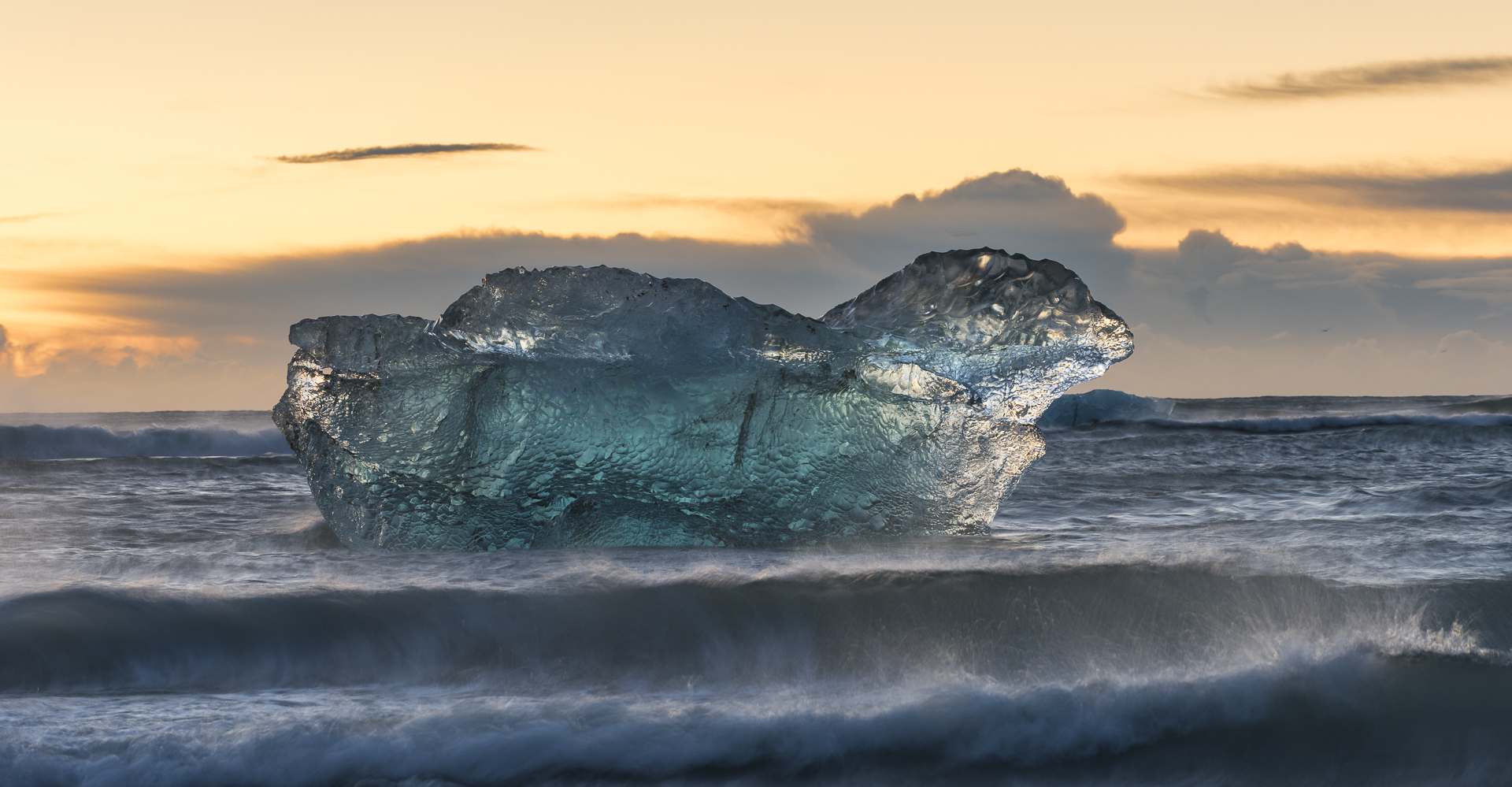 Iceberg floating past Jökulsárlón's Ice Beach