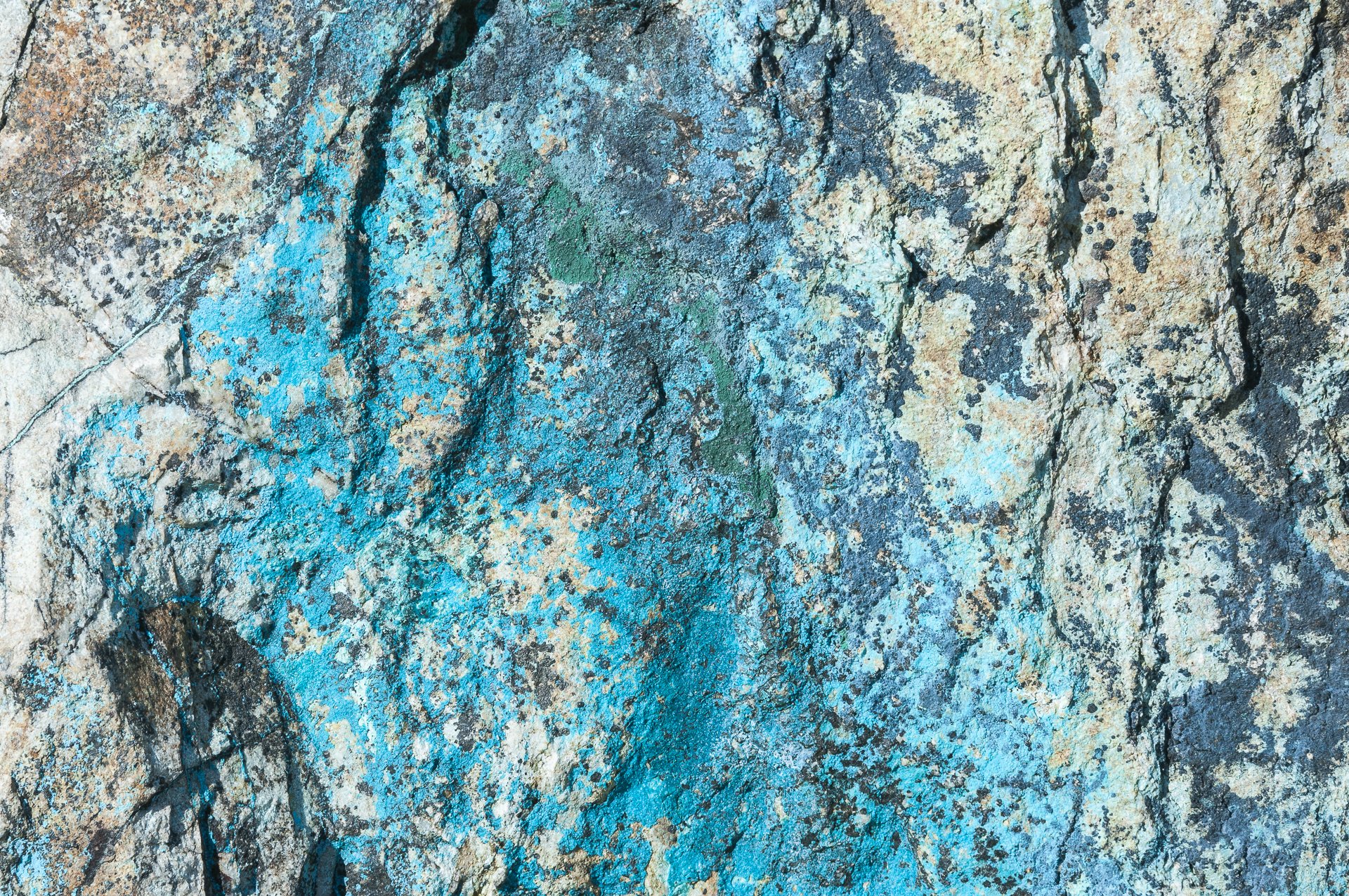  Copper-bearing minerals such as chrysocolla, azurite and malachite.