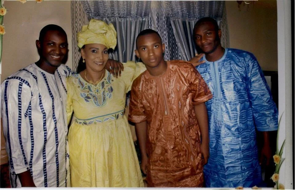 Salifou's proud mother with her three sons. Something that is the same in Mali and the US: parents are proud when their children excel in school!