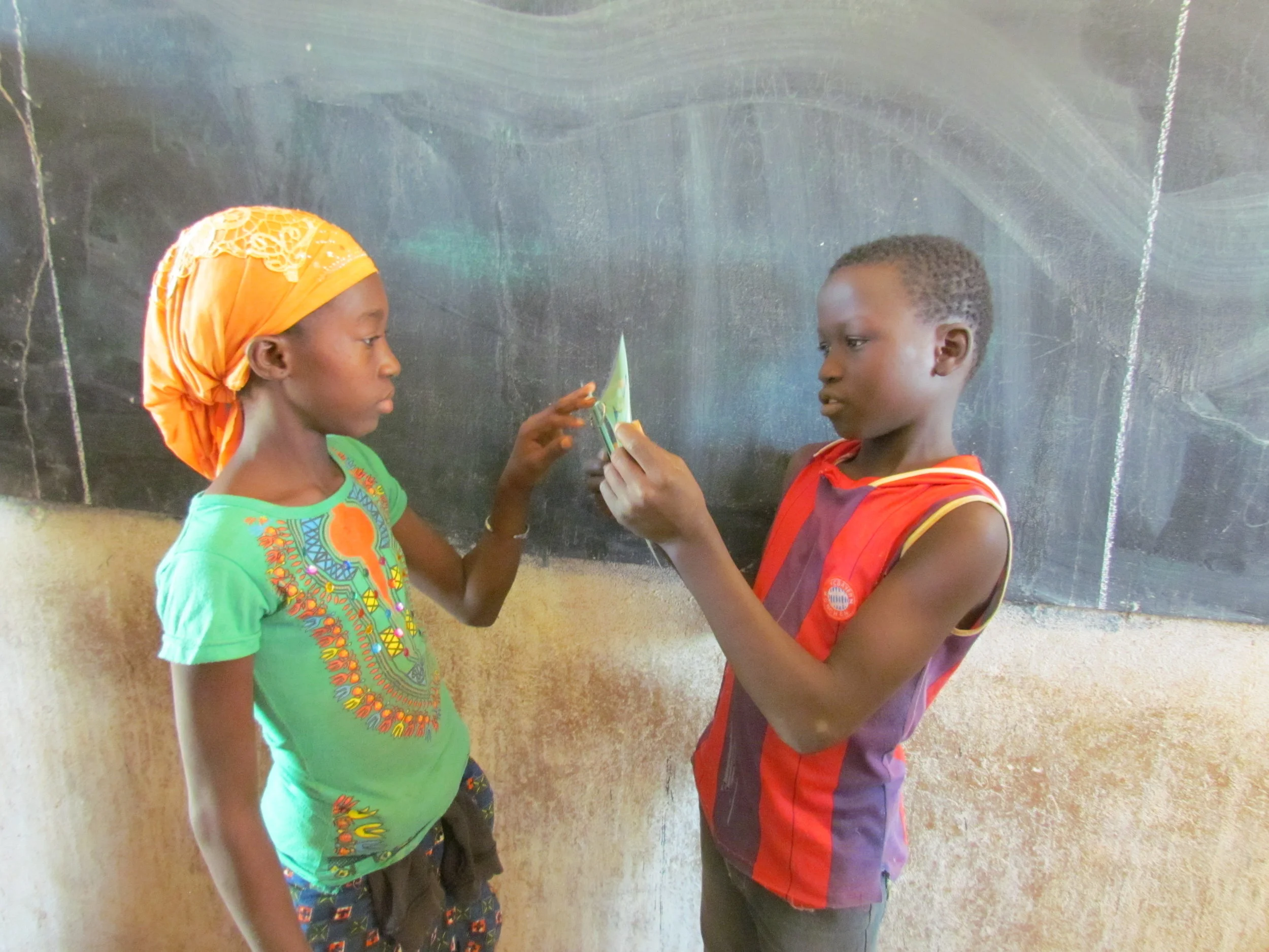 Kids in Mali test run our first batch of flashcards, created by high school students in Eugene, Oregon.