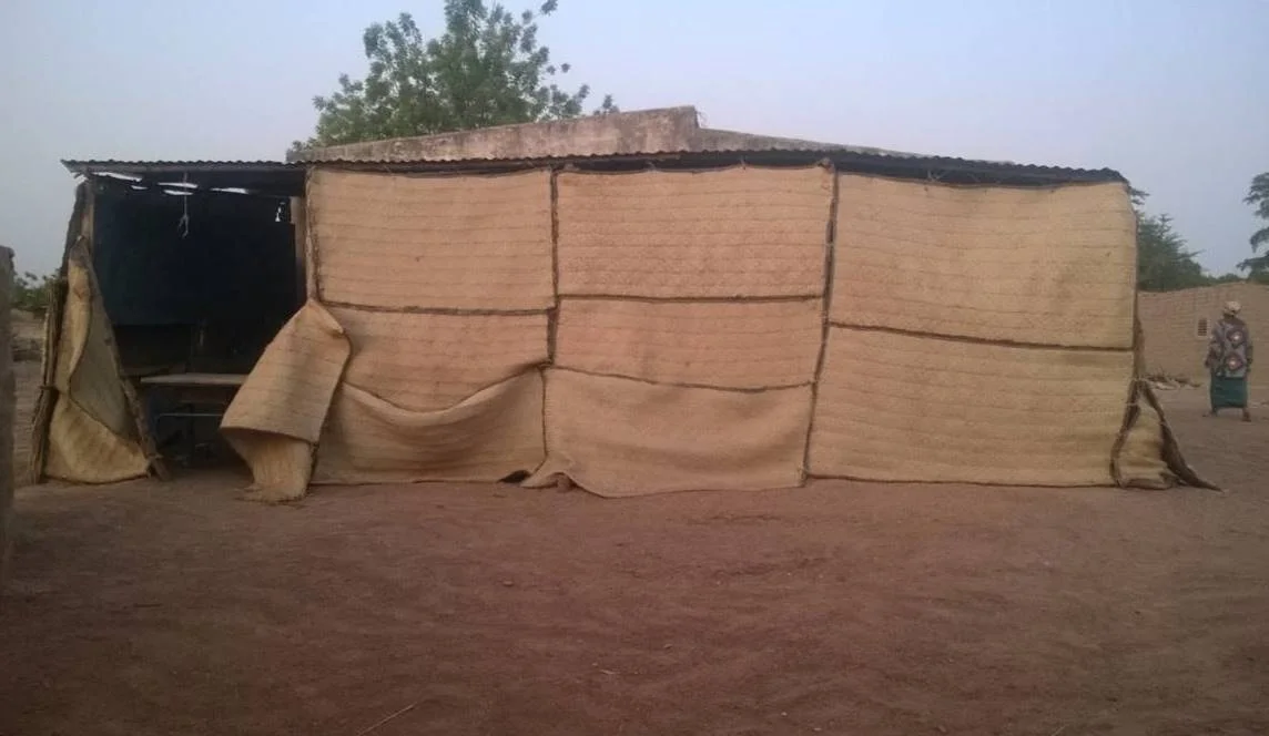 This is Kadia's middle school classroom. Despite the conditions, Kadia manages to be the top student in her class.