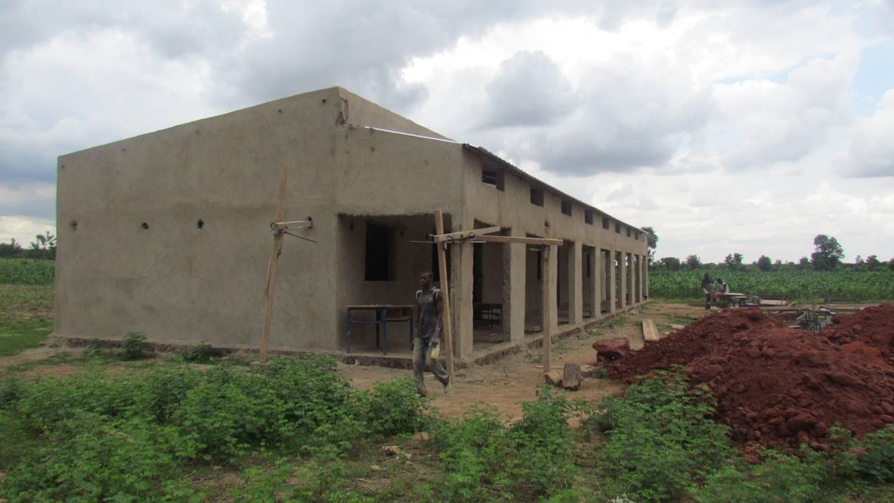  The main school building sports a roof and is plastered. This building includes three classrooms for 7th, 8th, and 9th graders. 