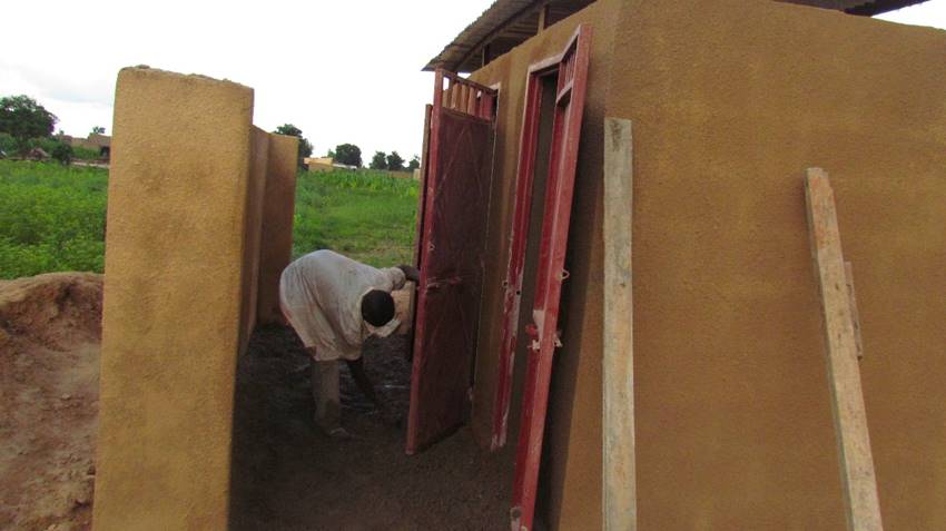  Putting the finishing touches on one of two banks of latrines. 