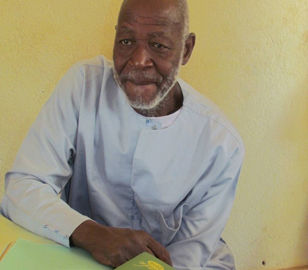 Mr. Coulibaly, head of the nursing school, watches his graduates with pride.