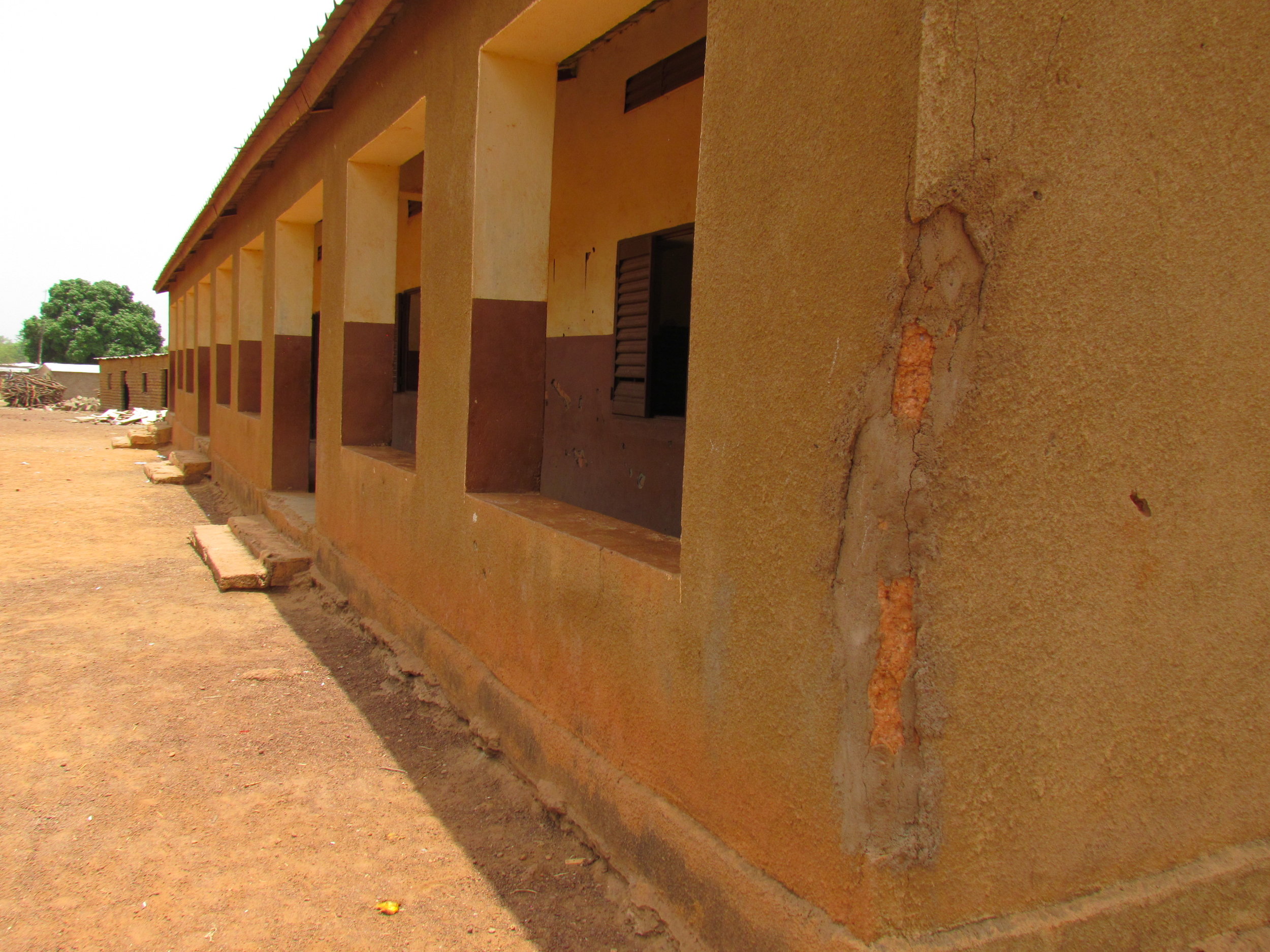 Corner cracking seen on some older, mud schools before repair.