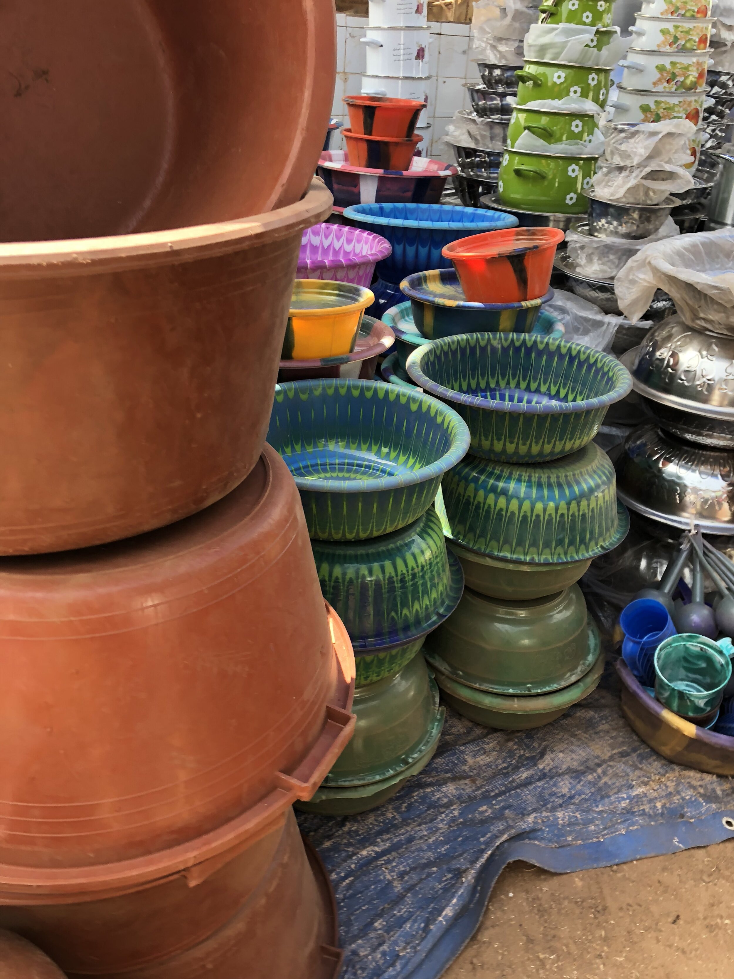 Colorful pots and pans for sale.