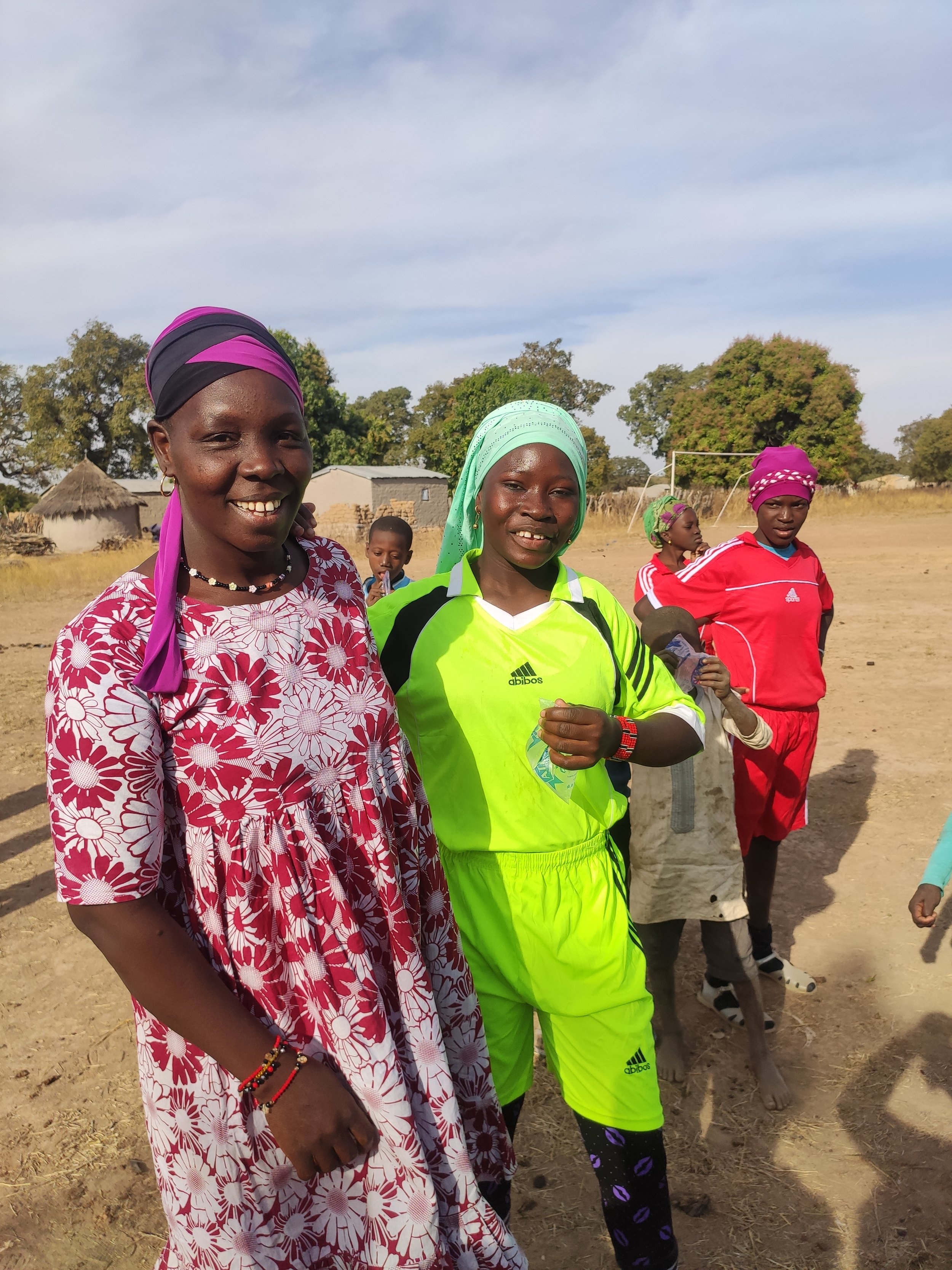 A proud Djenebou poses with her soccer playing daughter.
