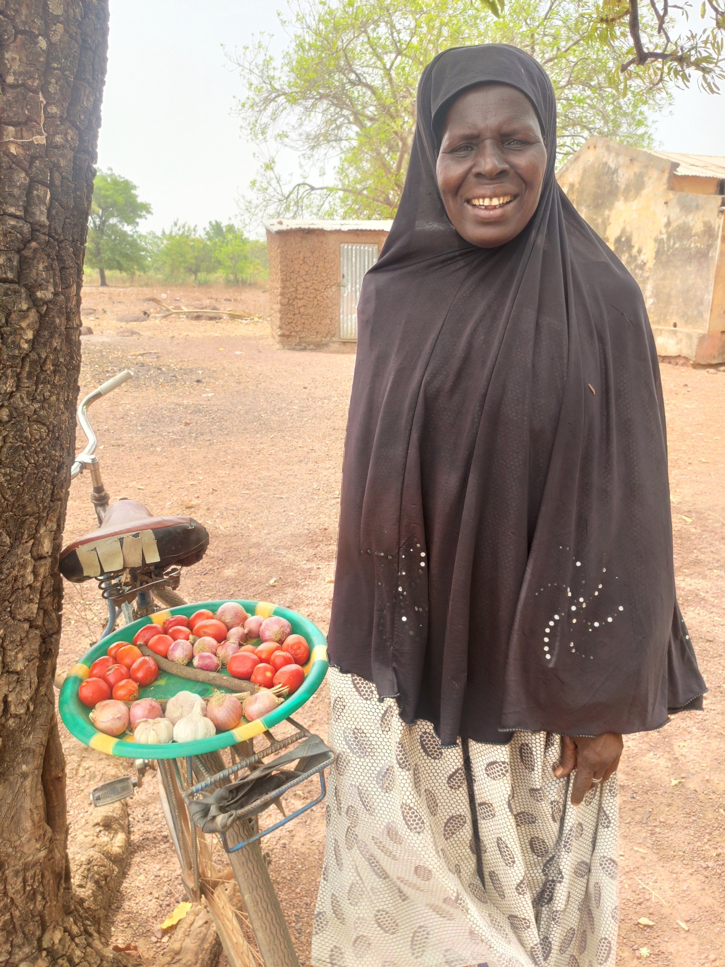 Deniba displays her wares on the back of her bike.