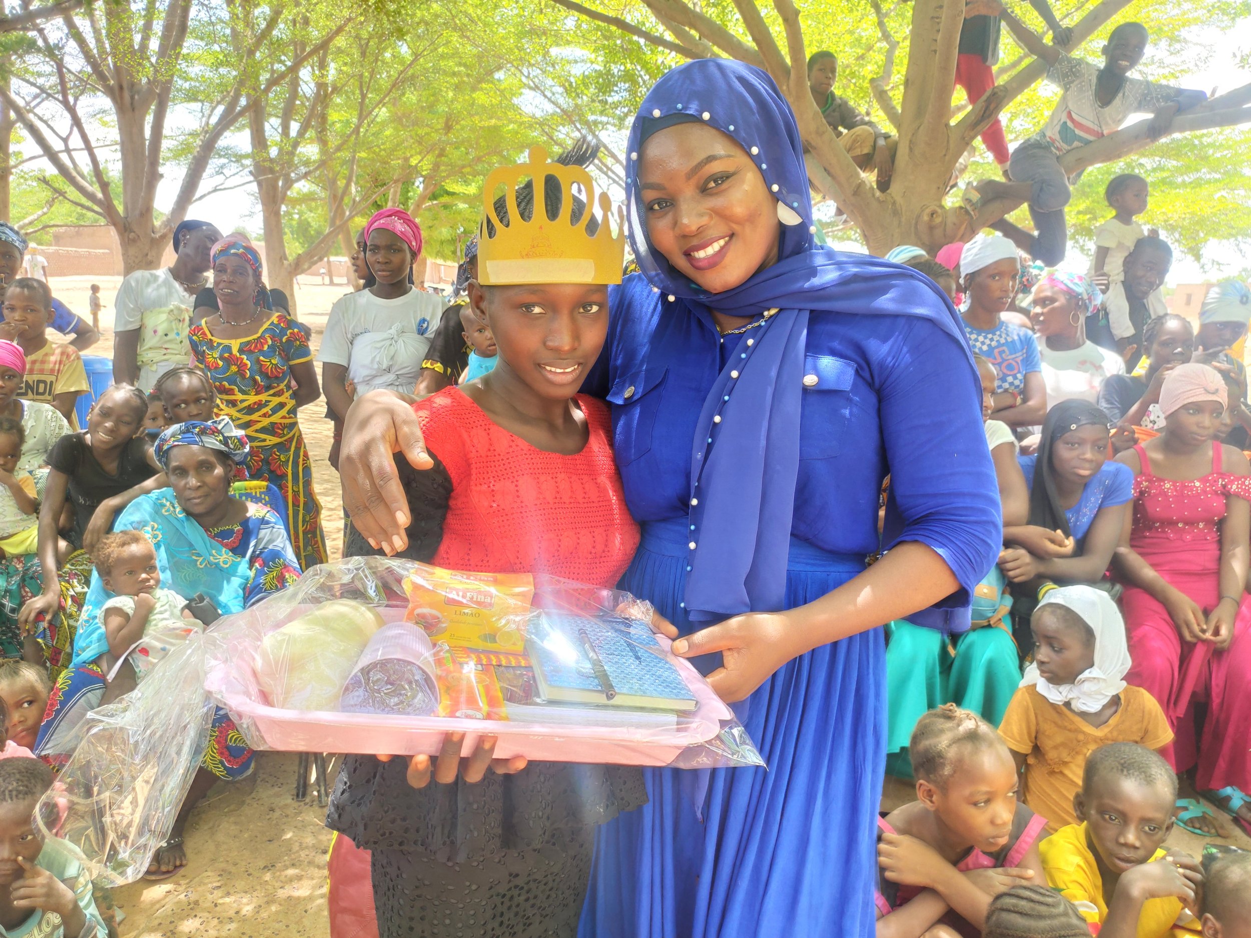 Aminata &amp; Hindaty pose with the winner's prizes.