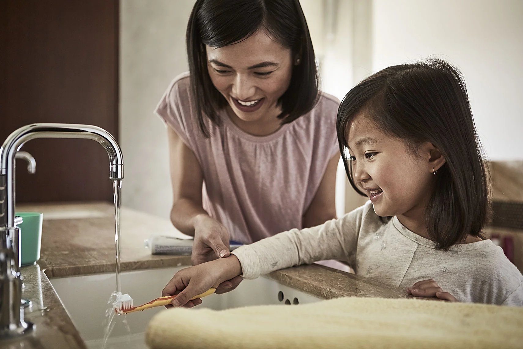 Jeremy-Frechette-Mother-daughter-brushing-teeth.jpg