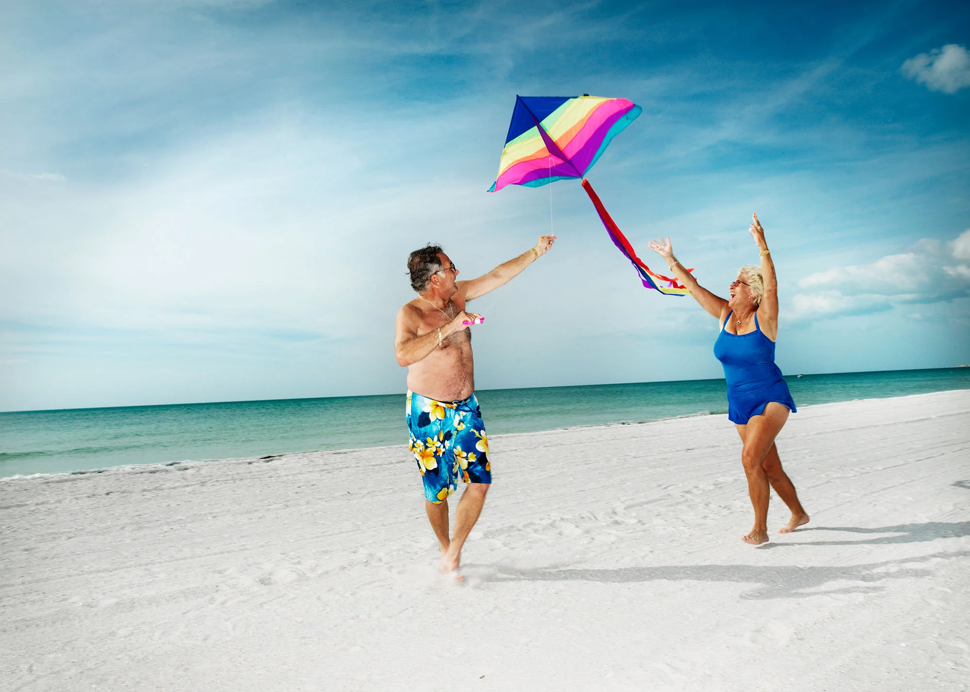 Frechette-frechette-senior-couple-retired-beach-flying-kite_RT.jpg