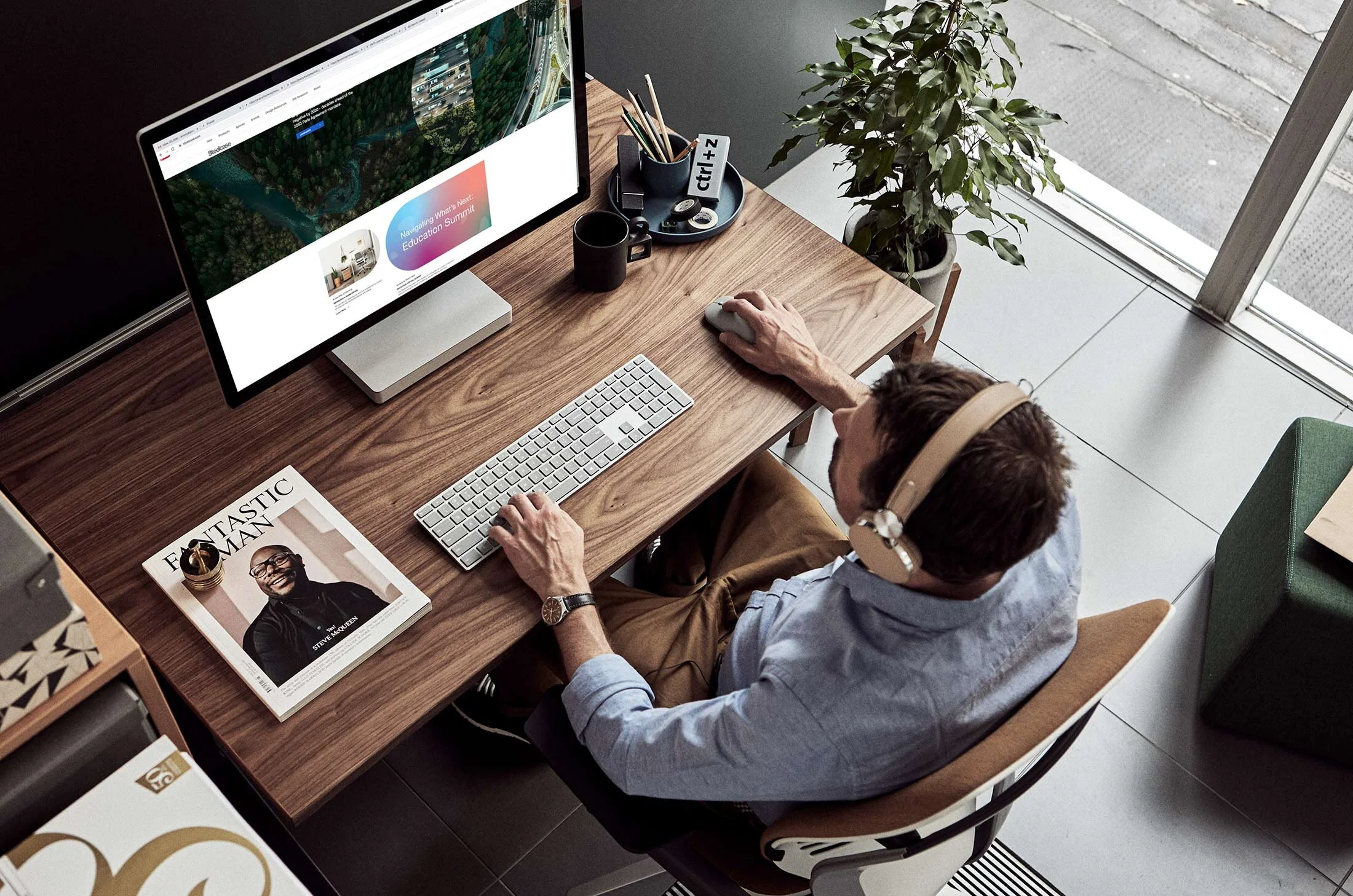 Jeremy-Frechette-male-desk-headphones-working.jpg