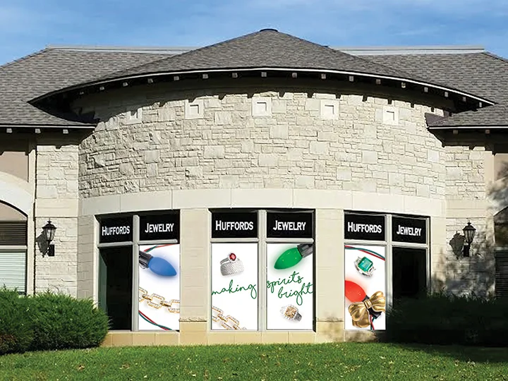 Huffords Jewelry's "Making Spirits Bright" exterior signage, visible from Clayton Road in Frontenac, Missouri.