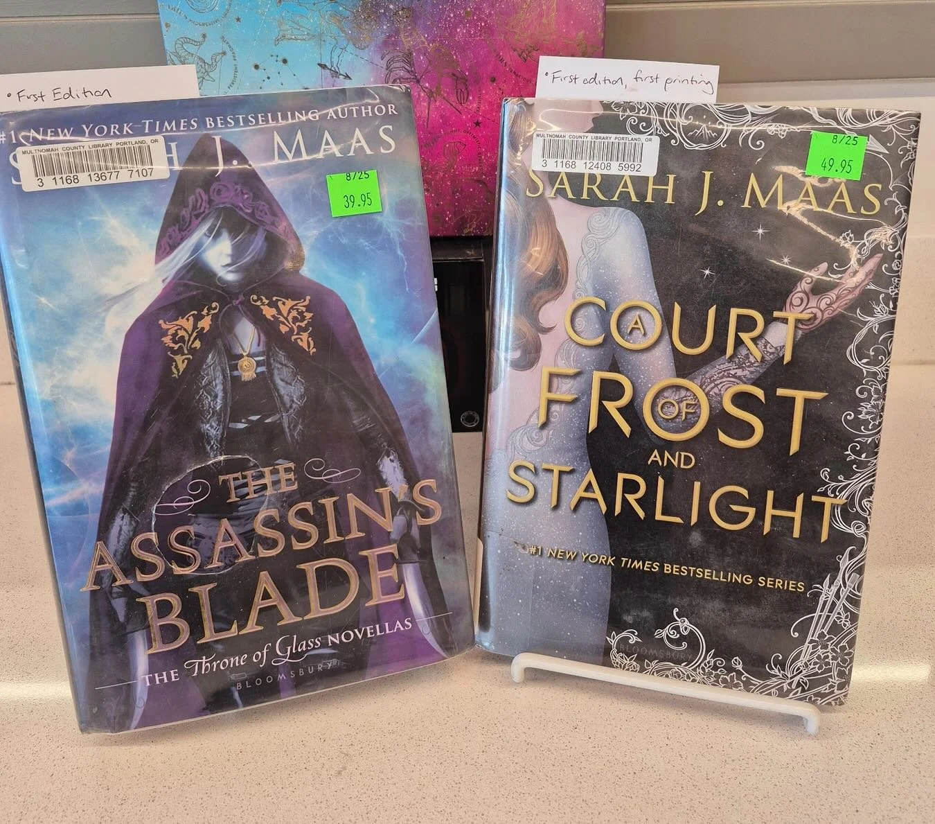 Sarah J Maas fans, we have a treat for you&hellip;or maybe two! We have a First Edition copy of &ldquo;Assassin&rsquo;s Blade&rdquo;, and a First Edition, First Printing of &ldquo;A Court of Frost and Starlight&rdquo;. Come pick these up for your col