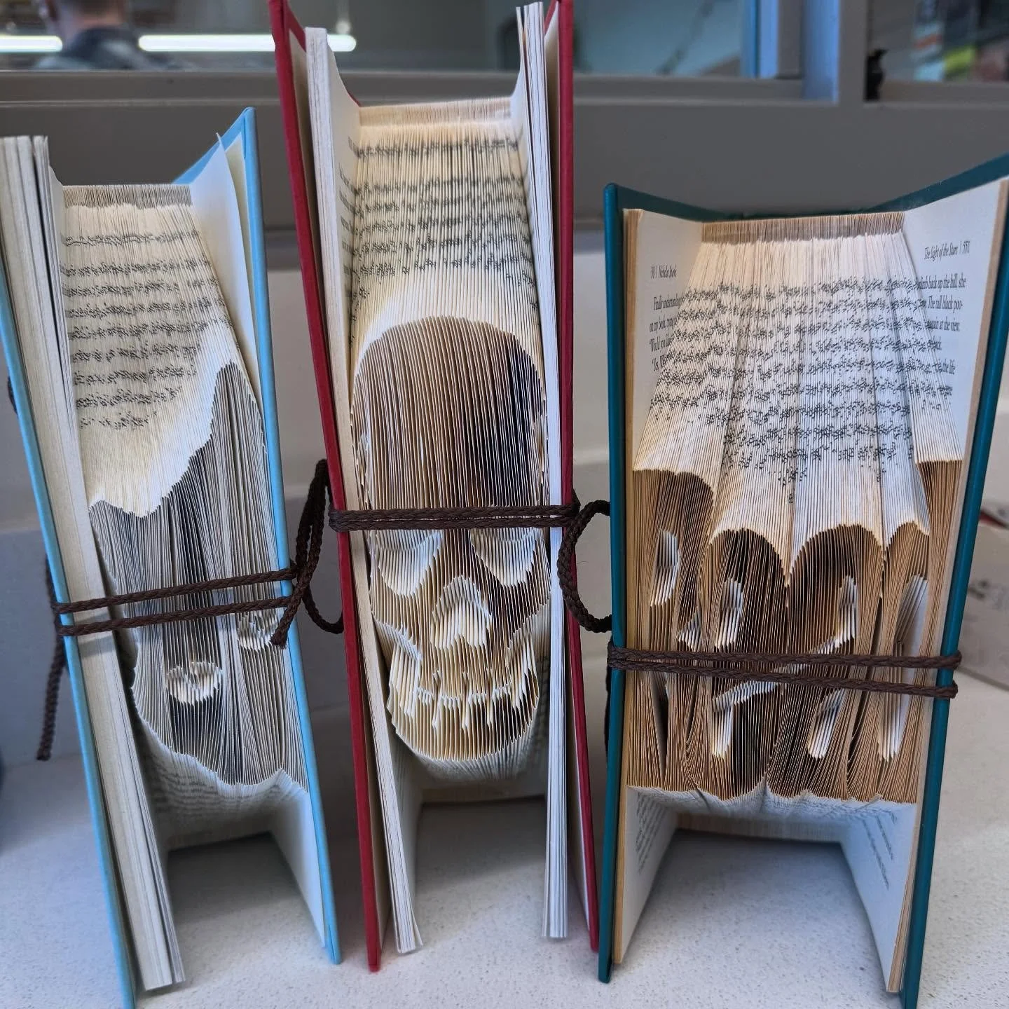 Our volunteers are scary talented. Volunteer Sherrolyn crafts folded book art from hardcovers we can&rsquo;t sell. One more phase in the book cycle of life. For sale at Rose City Reads &amp; Friends Library store. #friendsofthelibrary #rosecityreads 