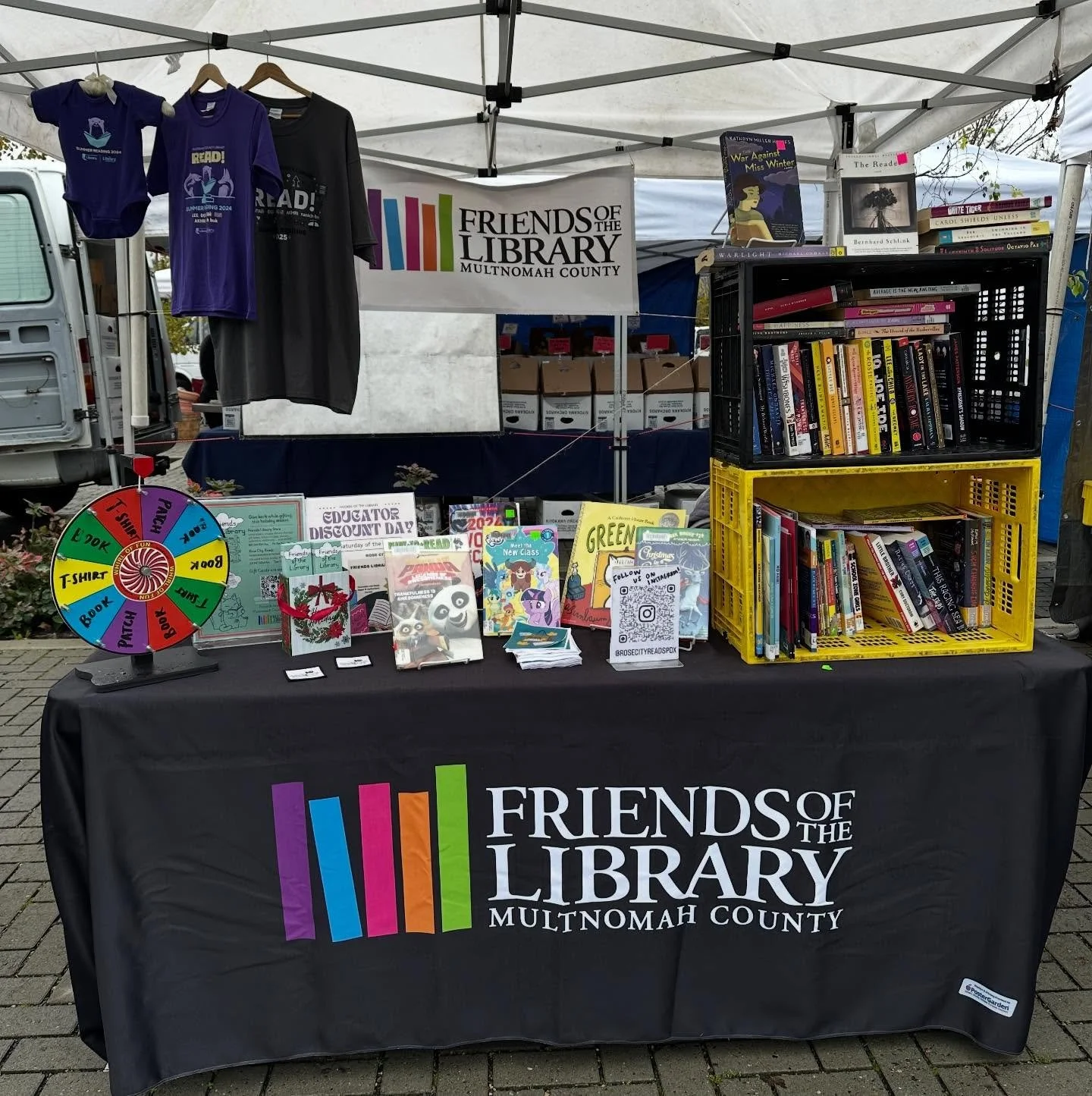 Come see us at the @lentsfarmersmarket today until 2:00! Spin the wheel for free books and t shirts! #lentsfarmersmarket #lents #friendsofthelibrary #rosecityreads