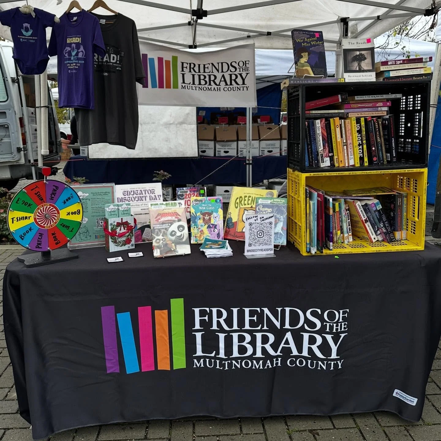 Come see us at the @lentsfarmersmarket today until 2:00! Spin the wheel for free books and t shirts! #lentsfarmersmarket #lents #friendsofthelibrary #rosecityreads