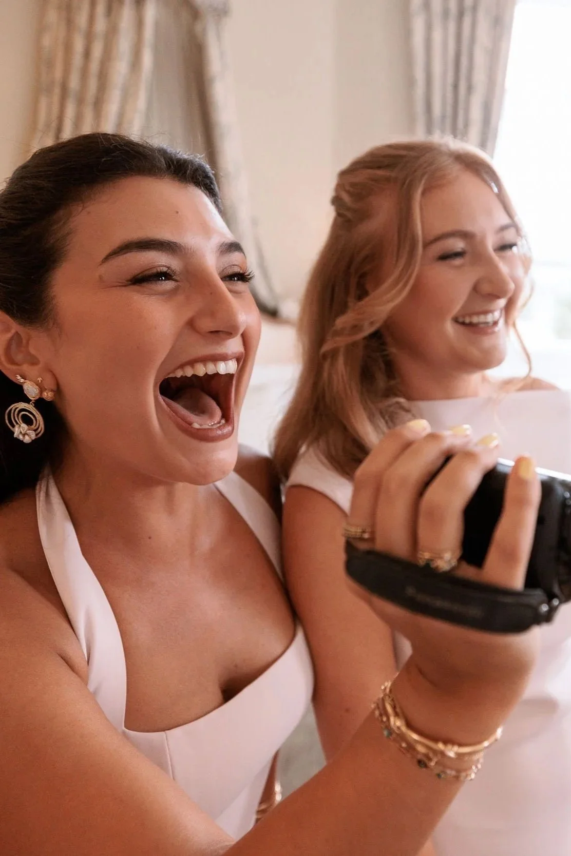 Bridesmaids laughing during wedding preparations at Middleton Lodge.